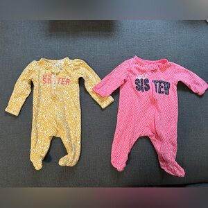 Two little sister Carter’s onesie size newborn and 3 months